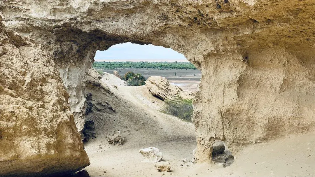The Arco — a natural stone arch above a hidden desert lake