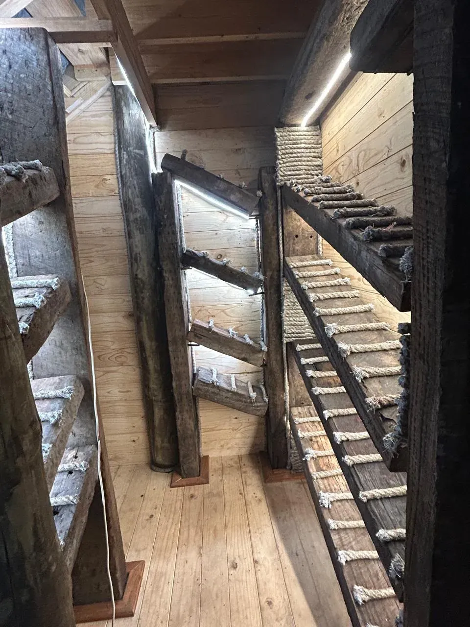 Hand-built driftwood-and-rope staircases inside Meob Lodge