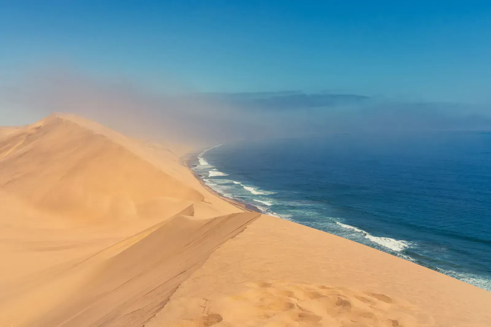 Towering dunes plunge straight into the Atlantic surf