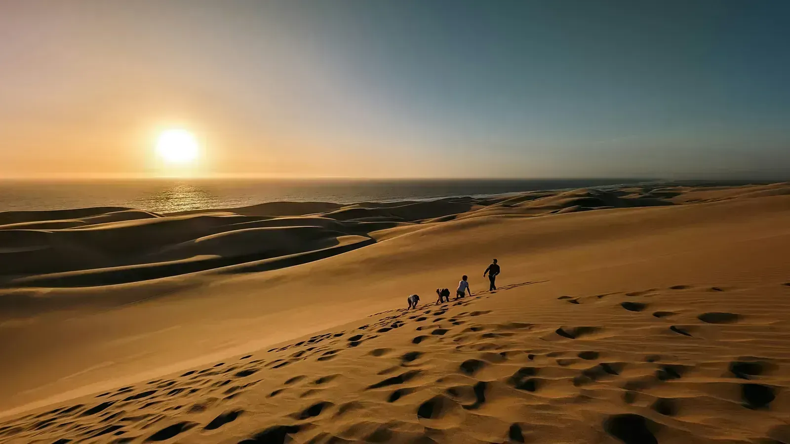 Hiking the dune crest for a sundowner over the sea